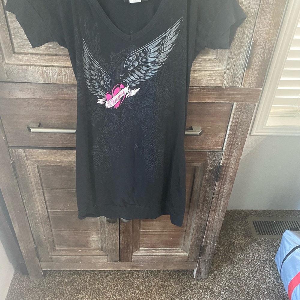 I’m selling a cute hustler dress. It can also be worn as a long shirt.
